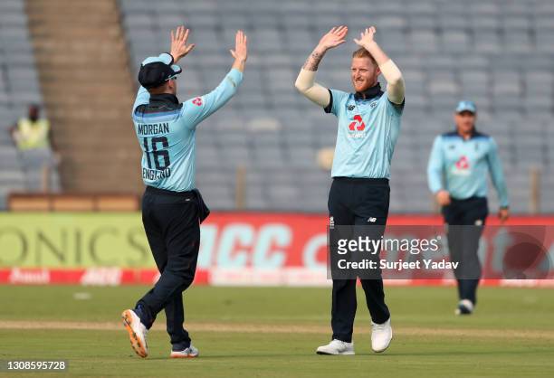 Ben Stokes of England celebrates with Eoin Morgan after dismissing Shikhar Dhawan of India during 1st One Day International between India and England...