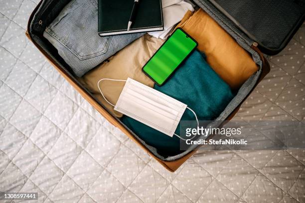 suitcase prepared for business meeting - open suitcase stock pictures, royalty-free photos & images
