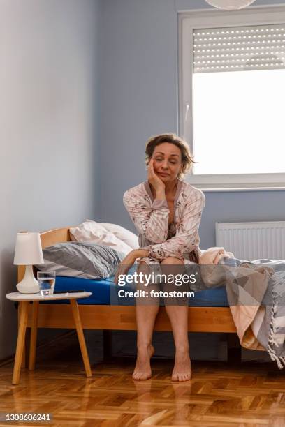tired woman doesn't want to get up in the morning - fatigue full body stock pictures, royalty-free photos & images