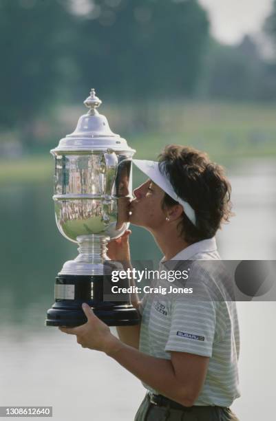 Juli Inkster of the United States kissing the Harton S. Semple championship trophy after winning the 54th U.S. Women's Open golf tournament on 6th...