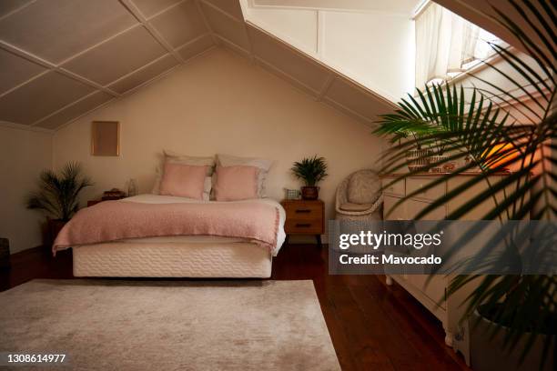 interior of a comfortable bedroom with pink accents - chest of drawers stock-fotos und bilder