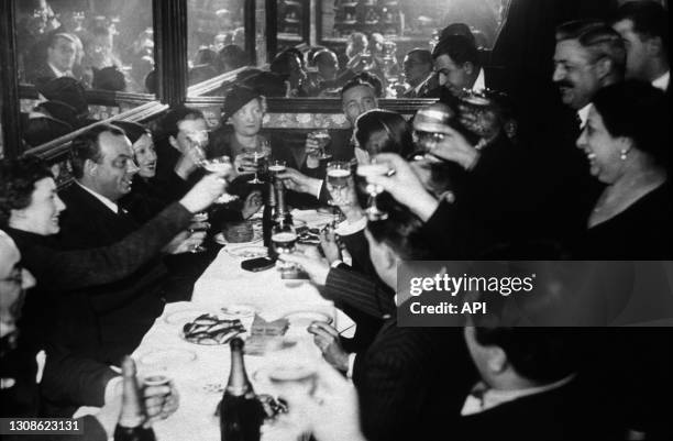 Aviator And Author Antoine De Saint Exupery At The Brasserie Lipp in Paris, Forties.