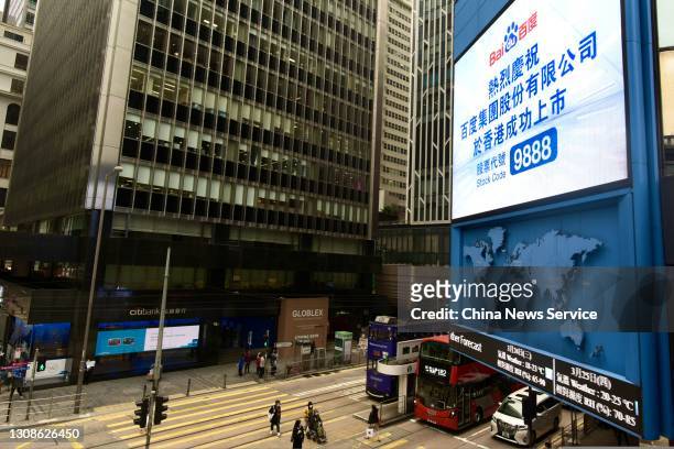 Screen showing words celebrating the listing of Baidu Inc. On the Hong Kong Stock Exchange is seen on March 23, 2021 in Hong Kong, China. Baidu Inc....