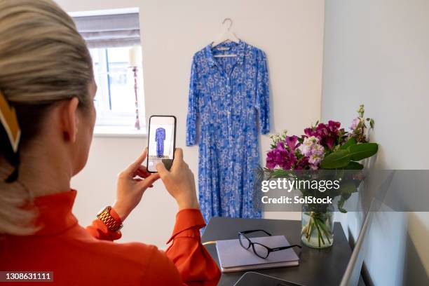 selling my dress online - woman photographing stock pictures, royalty-free photos & images