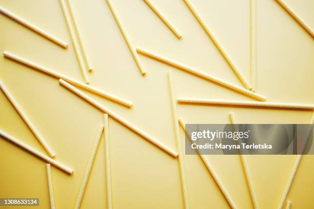 bright yellow background with yellow-white striped tubes. - light strip stock pictures, royalty-free photos & images