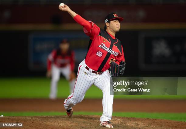 Pitcher Junichi Tazawa of Wei Chuan Dragons pitches at the bottom of the 9th inning during the CPBL game between Wei Chuan Dragons and Rakuten...