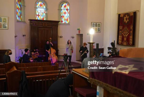 Members of the Berlin-based Sistanagila band of Israeli and Iranian musicians record a concert ahead of Passover at the Fraenkelufer Synagogue during...
