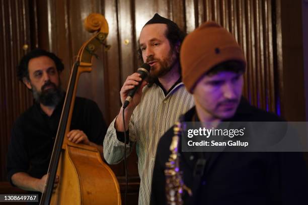 Singer Yuval Halpern and other members of the Berlin-based Sistanagila band of Israeli and Iranian musicians record a concert ahead of Passover at...