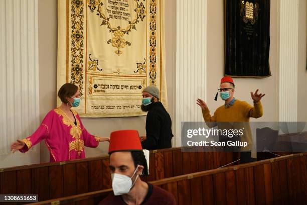 Members of the Fraenkelufer Synagogue Jewish community dance to the music of the Berlin-based Sistanagila band of Israeli and Iranian musicians as...