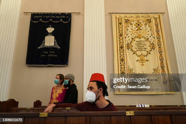 Members of the Fraenkelufer Synagogue Jewish community listen to the music of the Berlin-based Sistanagila band of Israeli and Iranian musicians as...