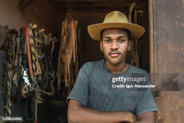 portrait of a latin cowboy - immigrant farm worker stock pictures, royalty-free photos & images