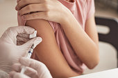 Doctor Vaccinating Little Girl Close Up