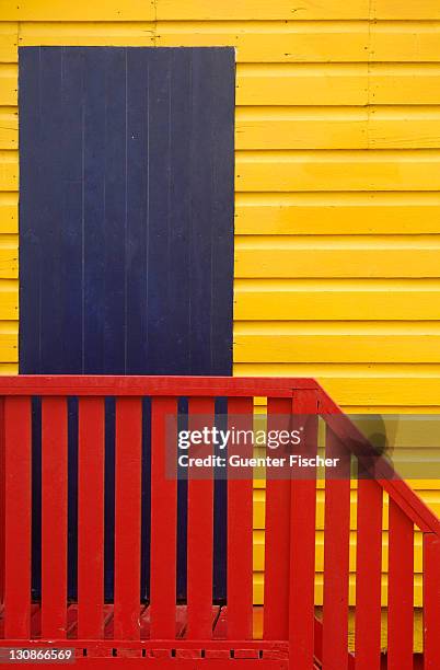 colourful changing rooms on the beach of muizenberg, western cape province south africa - lifes a beach stockfoto's en -beelden