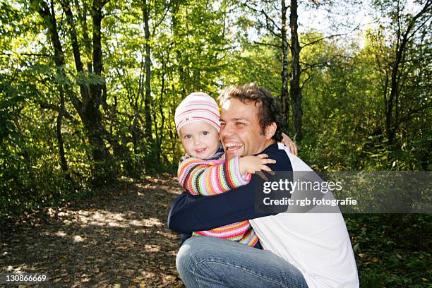father and his three-year-old daughter, hugging - 2 year old blonde girl father ストックフォトと画像