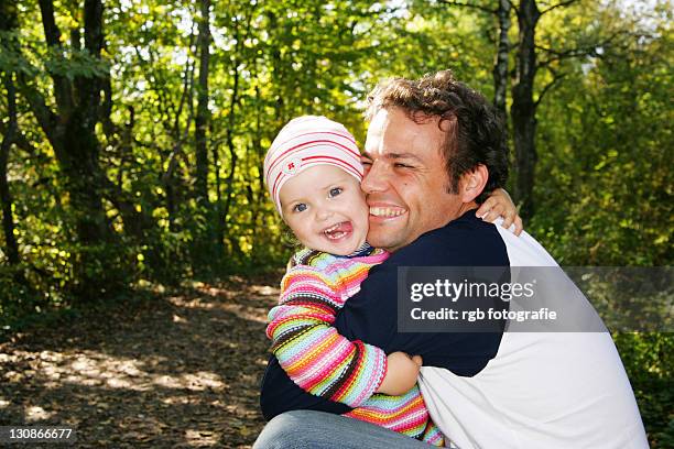 father and his three-year-old daughter, hugging - 2 year old blonde girl father ストックフォトと画像