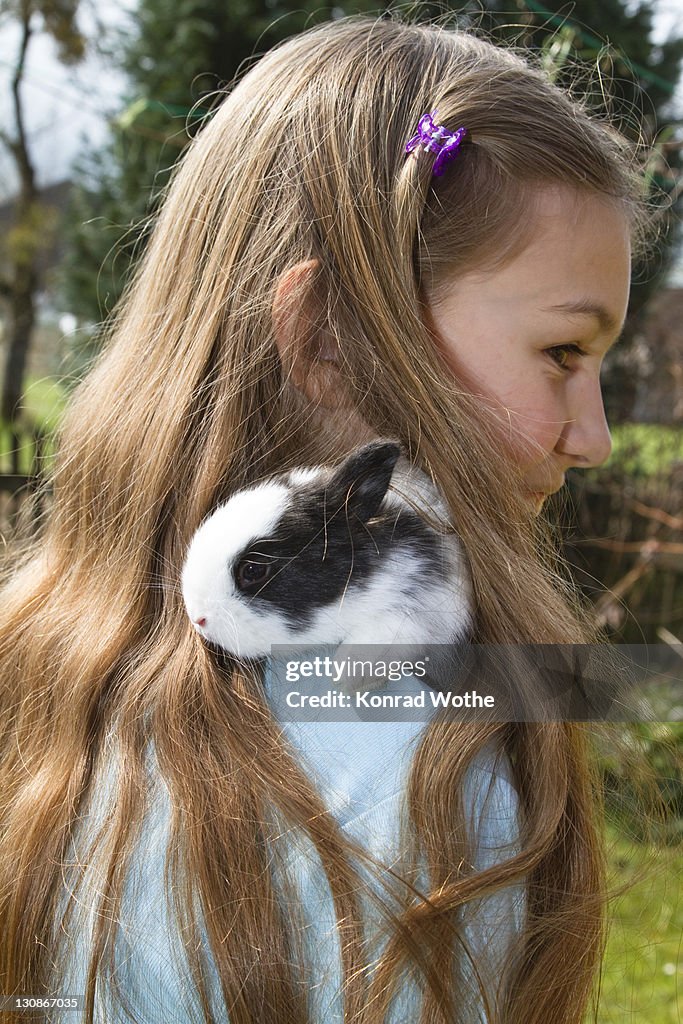 Girl, 10 years old, with a pet rabbit, Bavaria, Germany, Europe