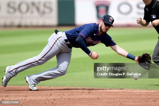 Riddle of the Minnesota Twins attempts to field a ground ball during the third inning against the Pittsburgh Pirates during a spring training game at...