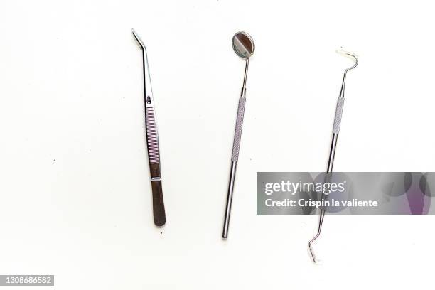 dentist instruments on white background - angled mirror stock pictures, royalty-free photos & images