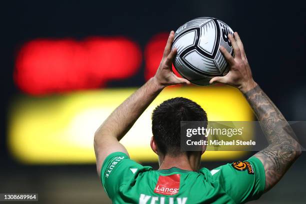 Michael Kelly of Yeovil prepares to take a throw in at Huish Park on March 23, 2021 in Yeovil, England. Sporting stadiums around England remain under...