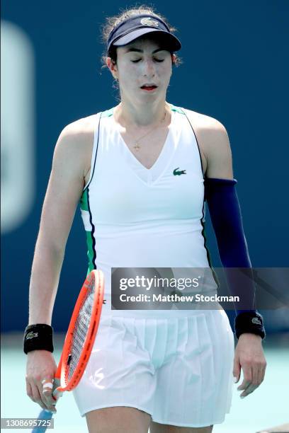 Christina McHale walks to her bench at a change of ends against Laura Siegemund of Germany during the Miami Open at Hard Rock Stadium on March 23,...