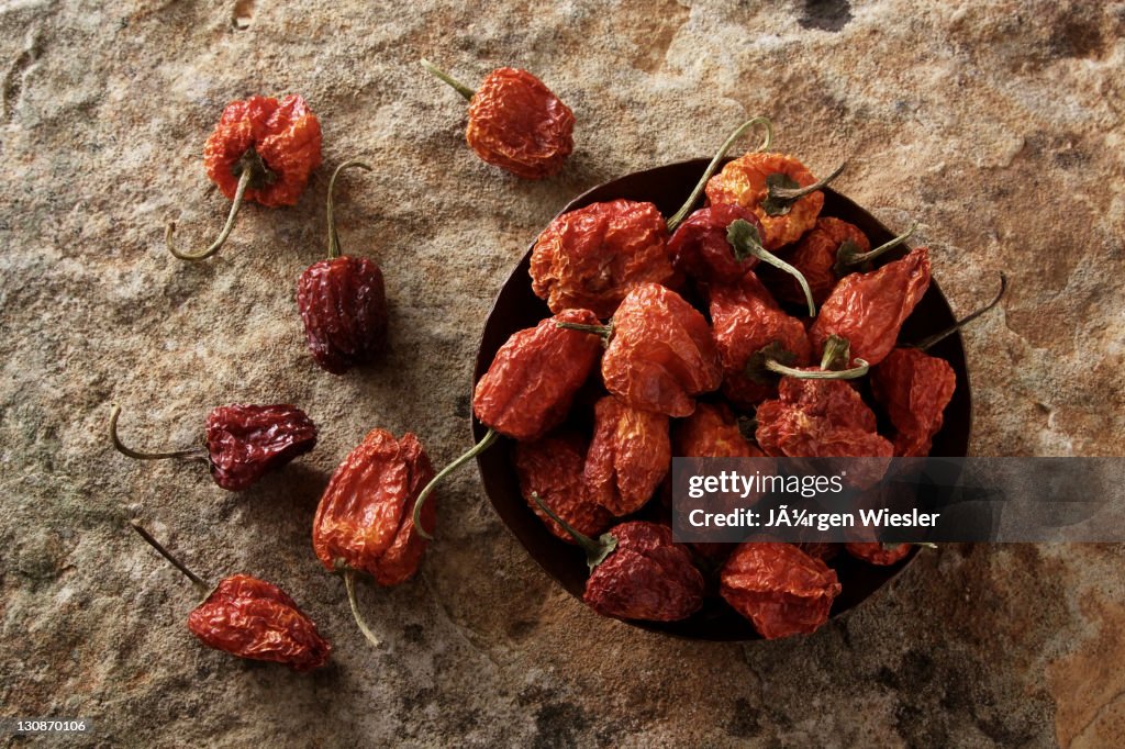 Bell Pepper (capsicum) in a copper bowl on a stone surface