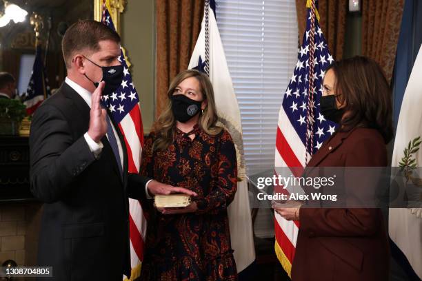 Marty Walsh is sworn in as U.S. Secretary of Labor by Vice President Kamala Harris as his partner Lorrie Higgins looks on during a ceremonial...