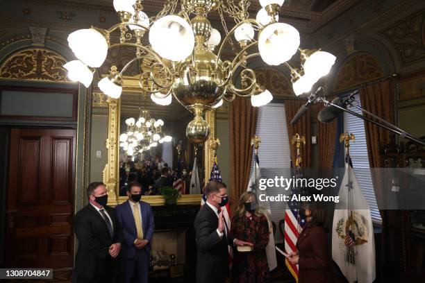 Marty Walsh is sworn in as U.S. Secretary of Labor by Vice President Kamala Harris as his partner Lorrie Higgins looks on during a ceremonial...