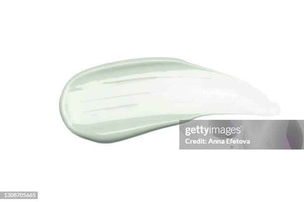 smooth cosmetic smear of pastel green cream isolated on white background. concept of health and wellbeing. flat lay style with copy space - paintbrush palette stock pictures, royalty-free photos & images