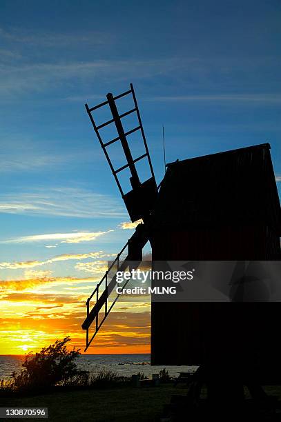 sweden, island oland, windmill and sunset - skandinavia stock pictures, royalty-free photos & images