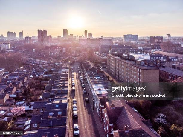 the sun setting over hackney road in east london - east london stock pictures, royalty-free photos & images