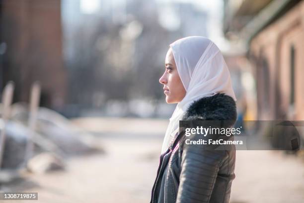 portrait of a modern muslim woman wearing a hijab - afghan stock pictures, royalty-free photos & images