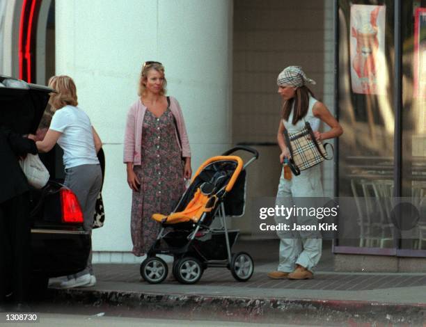 Pop Singer Victoria Adams "Posh Spice" along with her mother Jackie Adams get help loading the limo with there packages October 12, 2000 in Los...