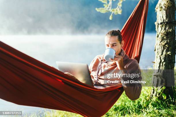 working could be pleasure. - hammock laptop stock pictures, royalty-free photos & images