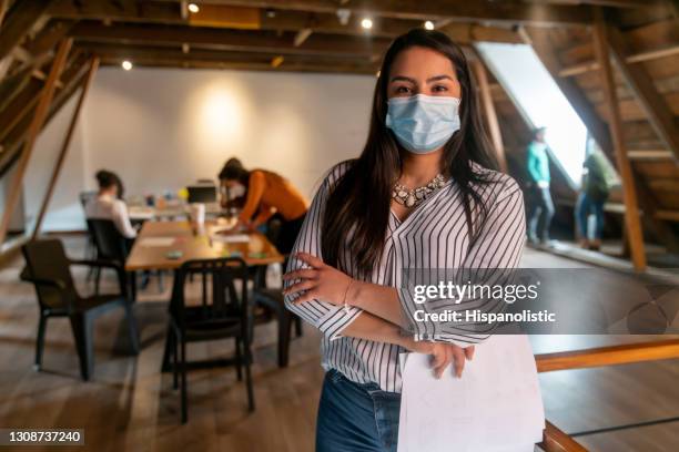 portrait of a business woman wearing a facemask at the office - biosecurity stock pictures, royalty-free photos & images