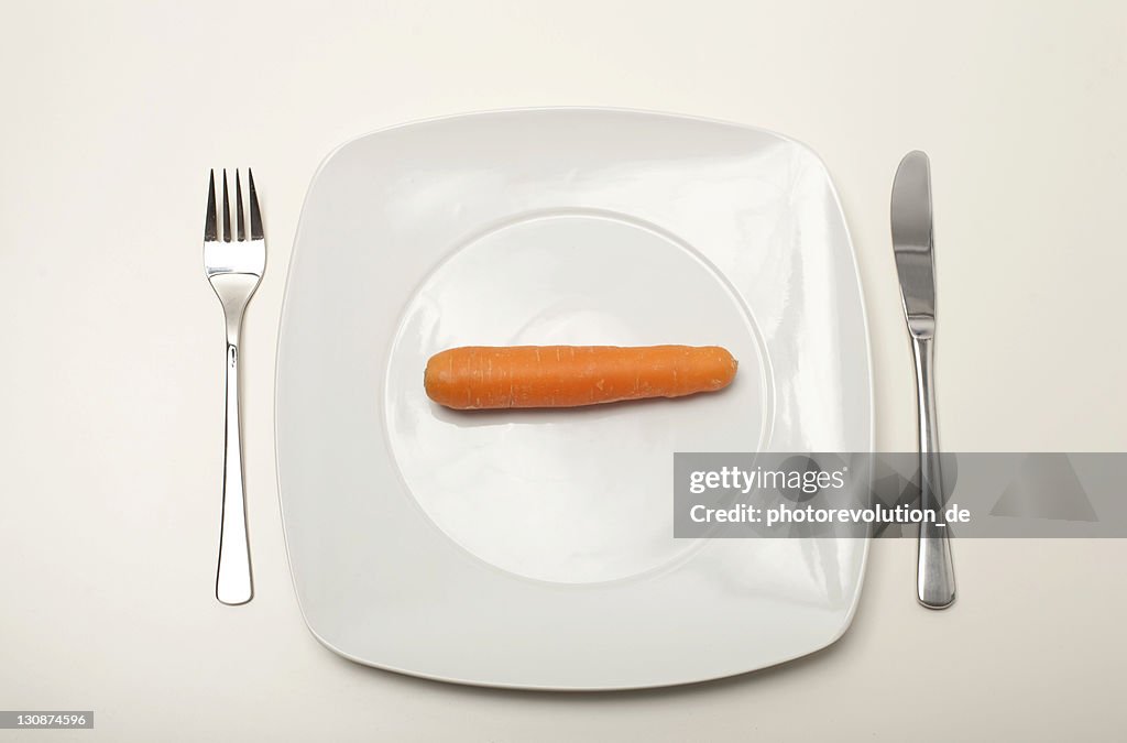 Carrot on a white plate