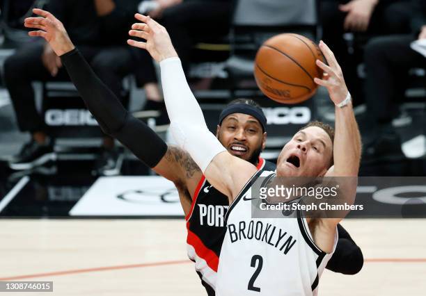 Blake Griffin of the Brooklyn Nets reaches for a pass while defended by Carmelo Anthony of the Portland Trail Blazers during the second quarter at...