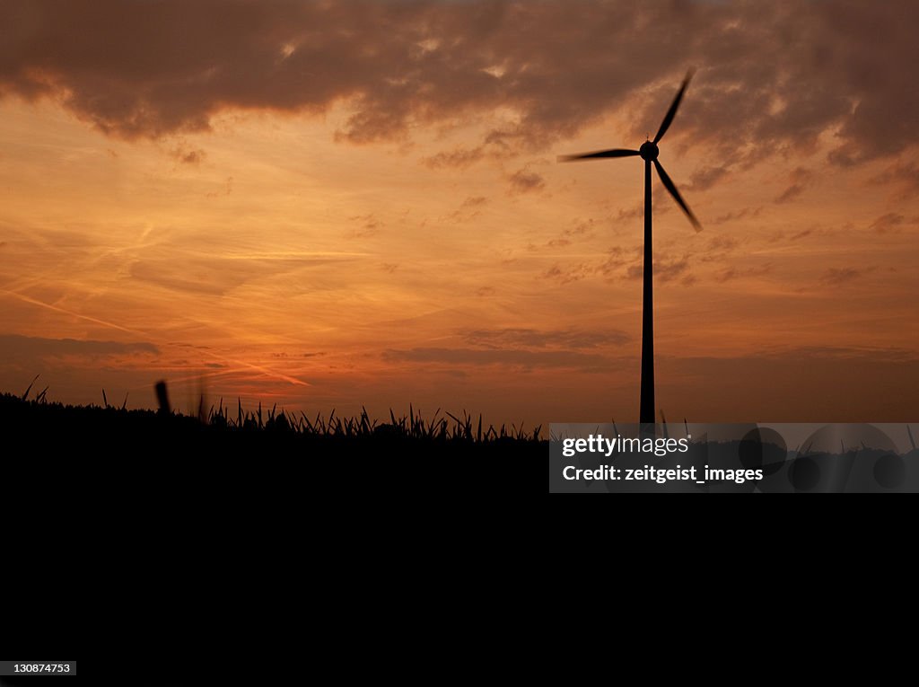 Windmill against evening sky