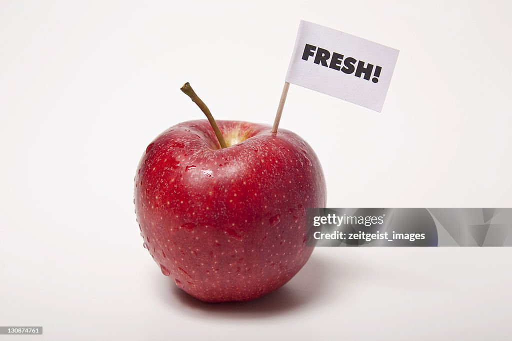Red apple, flag saying fresh!