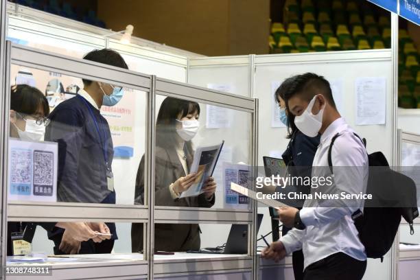 Job seekers look for job opportunities during the Greater Bay Area Youth Employment Scheme Job Expo held by HKSAR Labour Department at MacPherson...