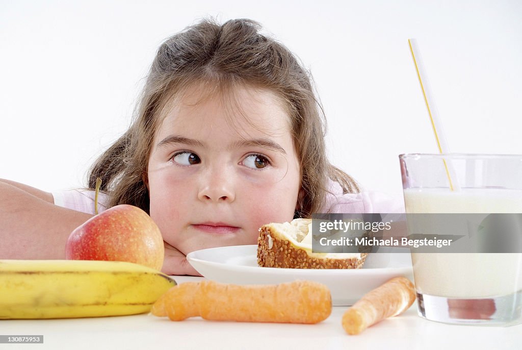 Chubby girl with healthy breakfast