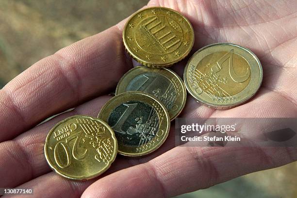 coins in the palm of a hand - coin in palm of hand stock pictures, royalty-free photos & images