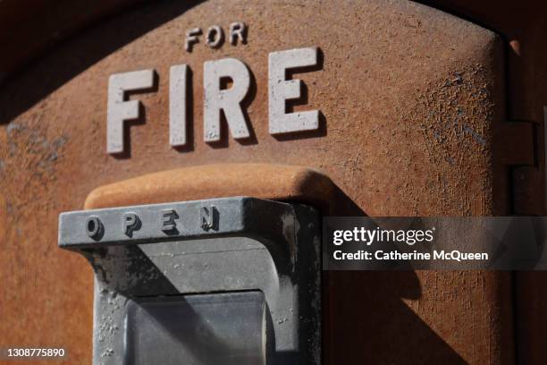 outdoor emergency fire department box at building entrance - vintage fire extinguisher stock pictures, royalty-free photos & images