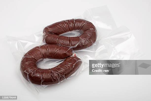 2 rings of black pudding in a vacuum bag - vacuum packed stock pictures, royalty-free photos & images