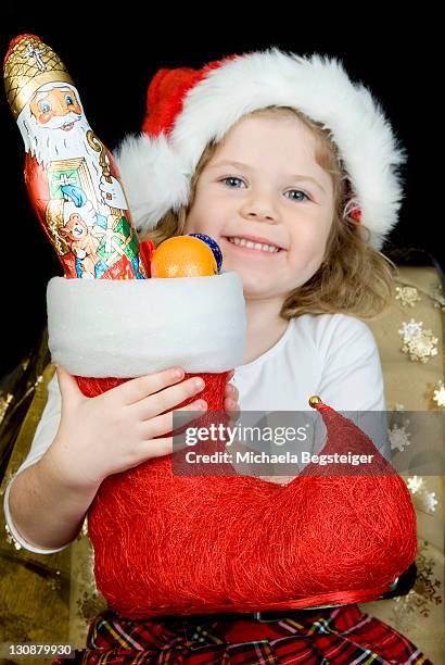 girl with christmas stocking - kid stocking stock pictures, royalty-free photos & images