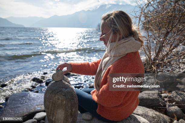 People Stacking Rocks 84,139 Stone Towers Stock Photos, High-Res Pictures, and Images - Getty ...