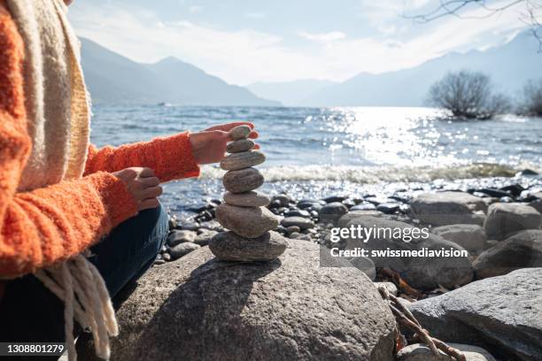 Man Stacking Rocks 125 Hand Stacking Stones Stock Photos, High-Res Pictures, and Images ...
