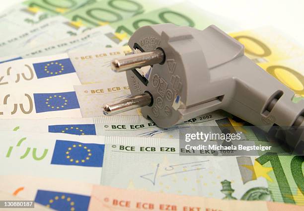 symbolic for electricity costs - energy tariff stock pictures, royalty-free photos & images