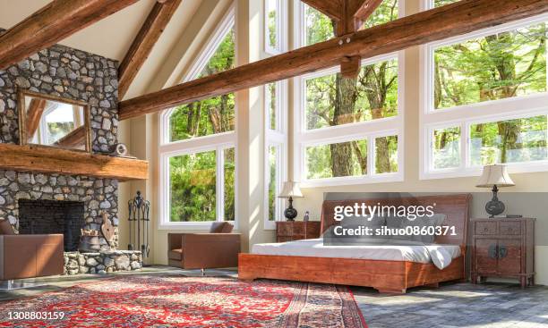 dormitorio con chimenea chalet de lujo - cabaña de madera fotografías e imágenes de stock