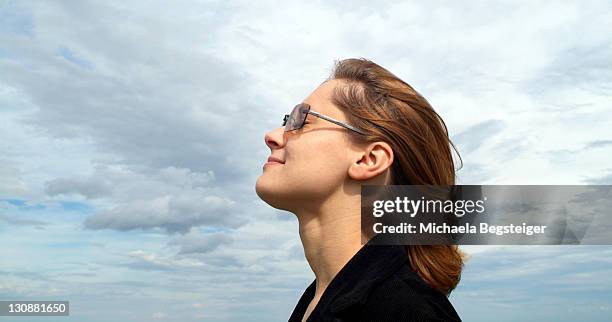 woman breathe fresh air - deep breathing stock-fotos und bilder