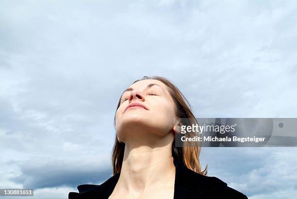 woman breathe fresh air - deep breathing stock pictures, royalty-free photos & images